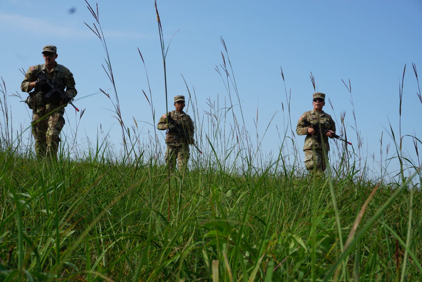 Cadets walking through a field.