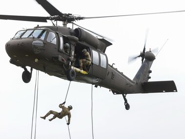 Cadets rapelling out of a helicopter.